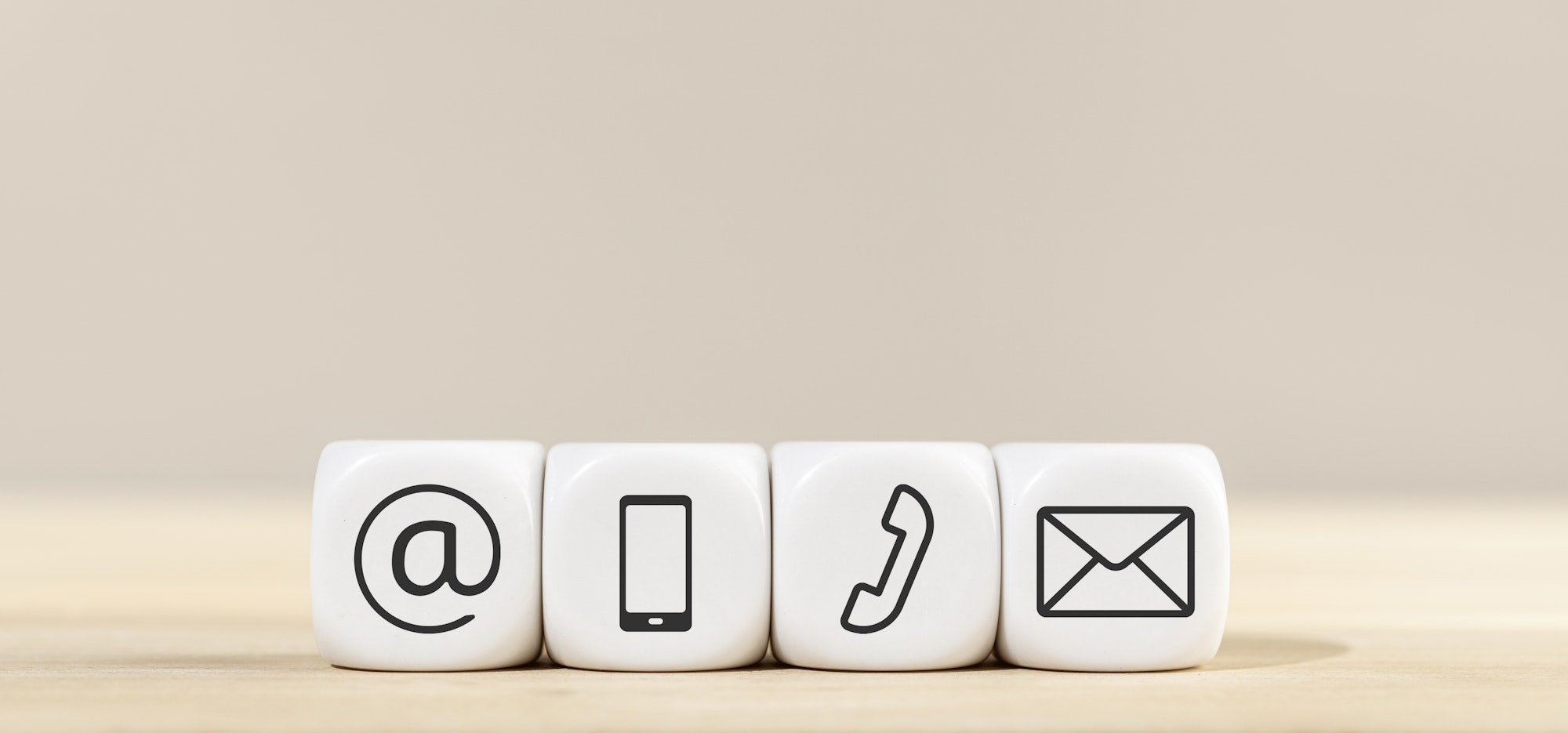 Contact us icons on white cube blocks